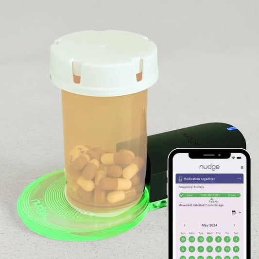 Nudge Medication Tracking Device With App Shown